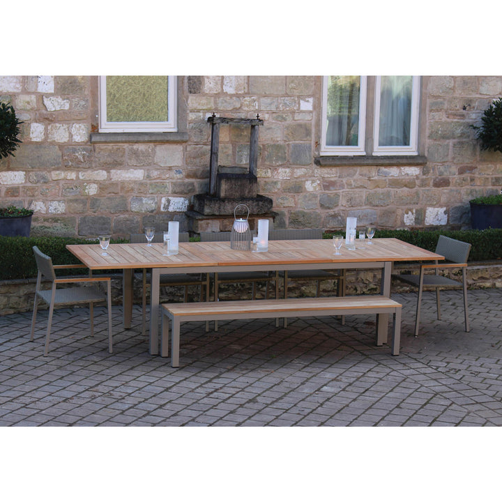 Atlantic Outdoor Teak Dining Table, Reclaim Bench and Modena Dining Chairs in Kubu grey